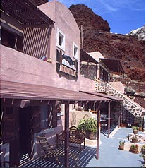 Amoudi Villas main hotel terrace - high above one can see the village of Oia