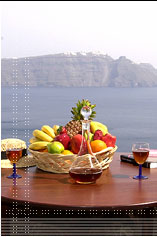 Simplicity at its best - a basket of fruit & a glass of wine over the Caldera